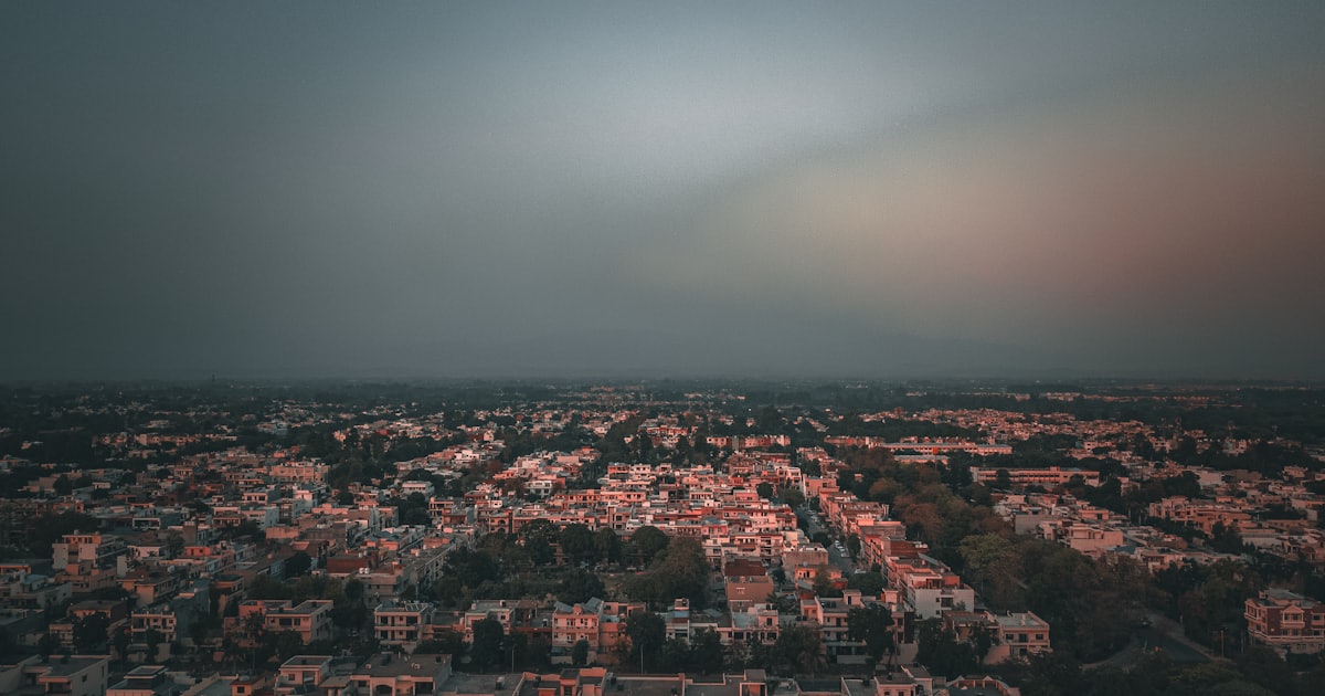 Aerial dusk view of a Panchkula sector grid against the Shivalik hills